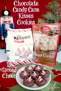 chocolate candy cane kisses cookies are on a plate next to a bag of krispy kreme