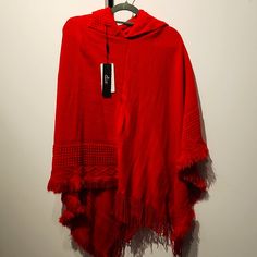 Red, Asymmetric, Detailed, Hooded Pancho. One Size Red Oversized Poncho For Winter, Oversized Red Poncho For Winter, Red Winter Cape One Size, Red One-size Poncho Cape, Red One-size Cape Poncho, Red One Size Cape Poncho, Casual Red Long Sleeve Poncho, Red Long Sleeve Poncho, One Size, Casual Red Cape For Autumn