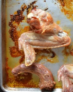 raw meat on a baking sheet ready to be cooked