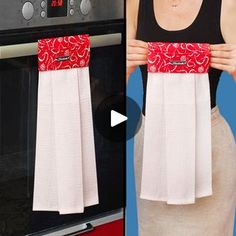 the woman is holding up her red and white napkins in front of an oven