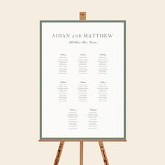 an easel with a seating chart on it and the words adam and matthew