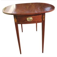 an oval shaped table with two drawers on one side and a drawer on the other