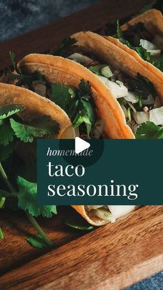 some tacos sitting on top of a cutting board with the words homemade taco seasoning