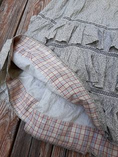 "Antique cotton floral calico everyday work skirt c.1860-70. With tiered ruffle skirt and a striking Greek key ribbon decoration. Inner hem lined in sweet cotton plaid. Side pocket. Fixed waistband with milk glass button. Good wearable antique condition. Expected signs of wear and age. There are faint marks and discoloration to the skirt. A few very small holes. There are some holes near the waistband and some rough inner stitching. Hole behind the button. Waist 25\" max Length 39\"" Peasant Cotton Skirt With Ruffles, Plaid Ruffled Cotton Skirt, Plaid Cotton Skirt With Ruffles, Cotton Gingham Skirt With Ruffles, Cottagecore Cotton Skirt With Ruffles, Vintage Cotton Ruffle Skirt, Vintage Ruffled Cotton Skirt, Vintage Plaid Cotton Skirt, Vintage Cotton Skirt With Ruffles