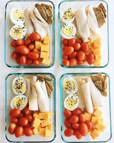 four glass containers filled with different types of food and veggies on top of each other