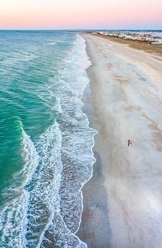 an aerial view of the beach and ocean