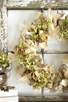 an old window is decorated with burlocks and flowers