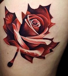 a red rose tattoo on the back of a woman