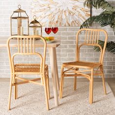 two chairs and a table in front of a brick wall