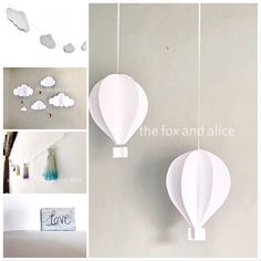 paper hot air balloons are hanging from the ceiling, and some clouds are on the wall