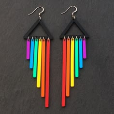 "\"The rainbow flag is a symbol of freedom and liberation that we made for ourselves.\" Gilbert Baker Wear these bright and colourful Rainbow statement earrings with pride. These mirrored acrylic chimes dance with the wind, and shine with the sun. Perfect for spreading love and positive vibes. Available as hook or Clip-on so no one misses out on the fun! Handmade to order from:  Glossy Black Acrylic bespoke triangle  All the colours of the rainbow in Mirrored Acrylic Chimes Approx 3cm by 9.5cm in size from top of triangle to lowest hanging chime.  Nickel free and lightweight! MATCHING NECKLACE available -  https://etsy.me/2QL0J85  Feel free to contact me for custom colour mixes." Pride Earrings, Symbol Of Freedom, Funky Earrings, Rainbow Earrings, Rainbow Flag, Funky Jewelry, Hypoallergenic Earrings, Fun Earrings, Crafted Jewelry