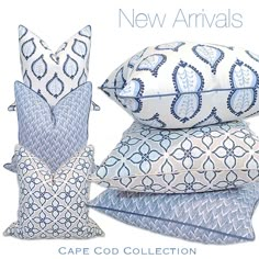 four pillows and two pillow cases with blue designs on them