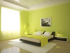 a bedroom with bright green walls and white carpeted flooring is pictured in this image