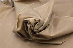 a close up view of a tan fabric