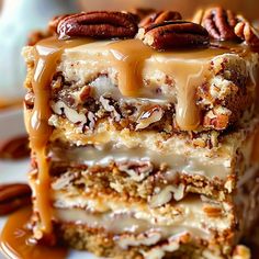 there is a piece of cake with pecans on the top and caramel drizzle