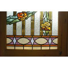 a stained glass window with flowers on it