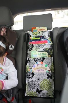 12 Insanely Clever Ways for Moms to Keep the Car Clean and Organized Car Book, Diy Sy, Book Holder, Car Organization, Costura Diy, Book Holders, Road Trippin, Book Storage, Creation Couture