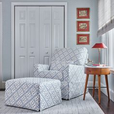 a living room with blue and white furniture