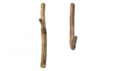 two pieces of driftwood are hanging on the wall