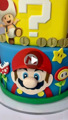 there is a cake with mario and luigi on it