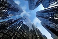 looking up at skyscrapers from the ground