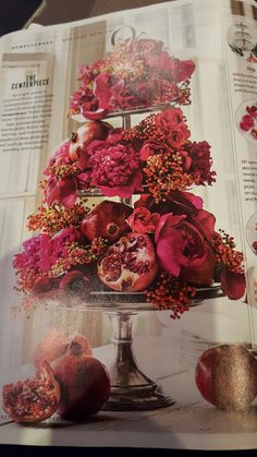 an open magazine with flowers and fruit on it