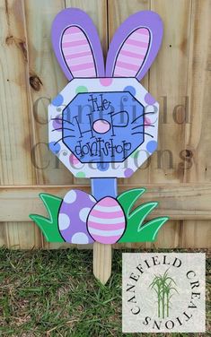 a wooden sign with an easter bunny on it