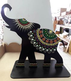 an elephant is decorated with jewels and beads