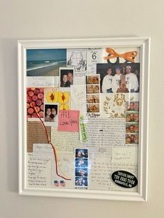 a collage of photos and letters is displayed on a white wall with a framed photo