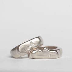 Oxbow's signature Kiss Rings come as a set of two. You can select two of the same size if you intend to wear them together, or choose two different sizes if you want to gift one or wear them on different fingers. Ring one is pictured on the bottom of the first photo & is the face with the nose. Details: Solid sterling silver rings Original design carved in wax and cast Signet style *please note, the kiss rings have a thick band, and most people prefer to size up by 1/2 size. This is just a note, Organic Rings Engagement, Organic Rings, Rings Silver, The Kiss, The Nose, Signet Ring, First Photo, Unique Rings, Original Design