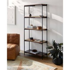 a living room with a couch and a book shelf