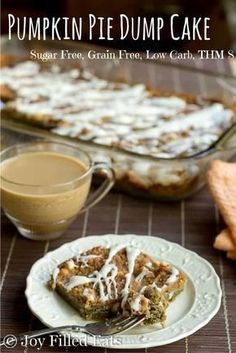 pumpkin pie dump cake on a plate with a cup of coffee and cinnamon roll in the background