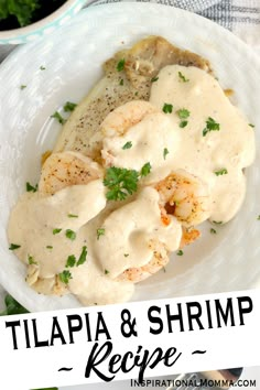 a white plate topped with shrimp covered in gravy