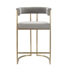 an upholstered chair with gold frame and grey fabric, on a white background