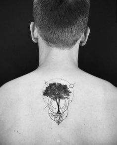 a man with a tree tattoo on his back