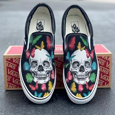 These black slip on Vans offer a custom skull and rainbow butterfly design. Get this design on white Vans: https://bit.ly/3OWqWQ0 We source each pair of blank shoes brand new directly from Vans. The ink is permanent and will never come off. Made in the USA. This price includes everything: shoes and artwork. Custom Vans Slip On Bad Bunny, Luxury Low-top Custom Sneakers For Skateboarding, Coustmize Vans, Monster Energy Custom Shoes, Drawn On Shoes For Men, Funny Shoes Custom, Custom Vans With Name, Custom Vans Sun And Moon, Custom Vans Slip On Lv