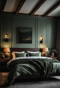 a large bed in a bedroom with green walls and wooden flooring, along with two lamps on either side of the bed