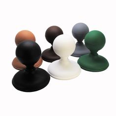 an assortment of different colored plastic knobs