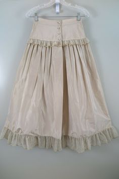 Vintage Tiered Skirt For Party, Vintage Dresses With Flowy Skirt, Vintage Long Dress With Gathered Skirt, Vintage Full Skirt In Beige, Vintage Long Dress With Lined Skirt, Vintage Long Skirt Petticoat, Vintage Long Skirt Dress With Lined Skirt, Vintage Long Beige Skirt, Vintage Tiered Petticoat With Lined Skirt