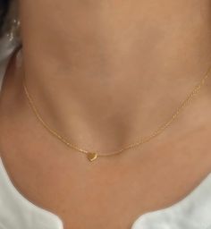 Solid 14K Heart Necklace, DINTY 14k Gold Heart, Tiny Heart Necklace, Solid Gold Jewelry, Gold Heart Necklace, Graduation Gift, Gift for Mom. This beautiful dainty solid 14k gold heart necklace is the perfect gift and great for any occasion. Beautifully worn on its own or layered with other necklaces. 14k (yellow) solid gold heart measures 8mm and is centered on a delicate shimmering cable chain. PLEASE convo me for custom orders. :) **PLEASE NOTE: THIS LISTING IS ONLY FOR ONE NECKLACE **All PHOTOS ARE ENLARGED TO SHOW DETAIL. **PROPS NOT INCLUDED. ** ♥ REAL SOLID 14KT GOLD. THIS ITEM IS NOT PLATED OR FILLED. ♥ 🎁 Comes ready to gift in a gift box or pouch. ♥BUY WITH CONFIDENCE♥ Please know I take customer service very seriously! There is nothing I want more than a happy customer and! If yo Small Gold Heart Necklace, Cheap Gold Heart Beads Jewelry, Dainty 14k Gold Heart Necklace For Wedding, Gold Heart Necklace Stamped 14k, 14k Stamped Heart Pendant Necklace, Dainty 14k Stamped Heart Pendant Necklace, Dainty Yellow Gold Heart Necklace For Wedding, 14k Gold Heart Necklace With Delicate Chain, 14k Stamped Heart Necklace For Wedding