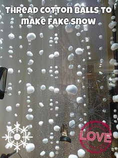 the window is covered with white balls and snowflakes