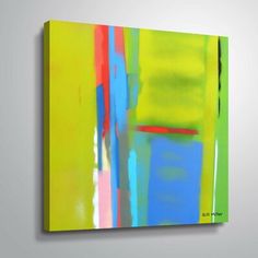 an abstract painting with bright colors on the wall