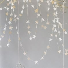 some white and gold stars hanging from the ceiling