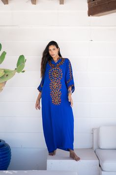 *Note : The kaftan in the video is a different color and is only displayed to show the fit, flow, and cut of the Kaftan. You will receive the one in the pictures.* A bohemian flash caftan made of light mesh of linen and poly, the fabric is unique in that it's very flowy and not the usual feel and touch of linen. This Kaftan is ideal to wear for any casual occasion. Whether taking a trip down the shopping lane, or home-based kitty parties, or about anything else, wearing this dress will make you Festive Blue Maxi Dress With Floral Embroidery, Blue Dress With Embroidered Border For Eid, Blue Eid Dress With Embroidered Border, Traditional Blue Tunic For Spring, Bohemian Cotton Kaftan With Embroidered Border, Blue Cotton Kaftan In Free Size, Blue Free Size Cotton Kaftan, Traditional Blue Embroidered Beach Dress, Blue Long Free Size Kaftan