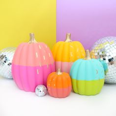 colorful pumpkins with disco balls in the background