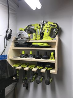 a workbench with many different tools on it in a storage area next to a light