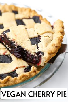 a close up of a pie on a plate with the words vegan cherry pie