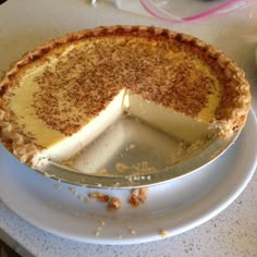 there is a pie that has been cut in half on the plate and ready to be eaten