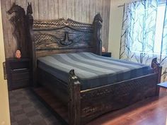 a bed sitting in the middle of a bedroom next to a wooden dresser and window