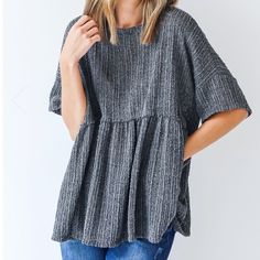 The Tell My Story Loose Knit Babydoll Top Lets Your Signature Style Speak For Itself! This Cute Top Is Designed With A Soft And Stretchy Loose Knit. It Features A Rounded Neckline, Short Sleeves, And An Oversized Babydoll Fit. Style The Tell My Story Top With Denim And Booties For A Cute Fall Look! Cute Pointelle Knit Tops, Cozy Chunky Knit Gray Tops, Gray Chunky Knit Top, Cozy Gray Chunky Knit Top, Gray Textured Knit Top, Gray Cotton Knit Tops, Cozy Gray Knit Top, Gray Ribbed Knit Top, Cute Knitted Tops